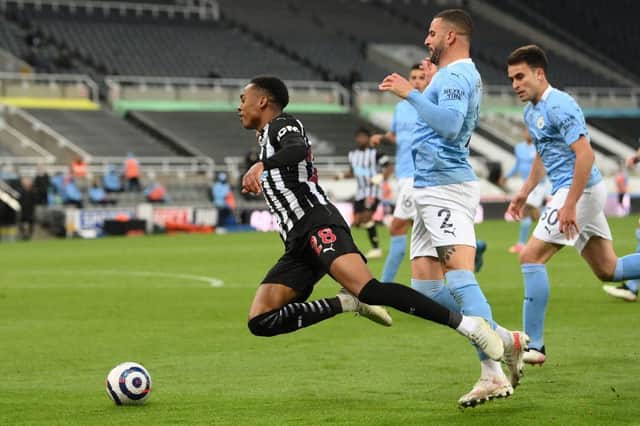 Manchester City's English defender Kyle Walker (2R) fouls Newcastle United's English midfielder Joe Willock to concede a penalty during the English Premier League football match between Newcastle United and Manchester City at St James' Park in Newcastle-upon-Tyne, north east England on May 14, 2021.