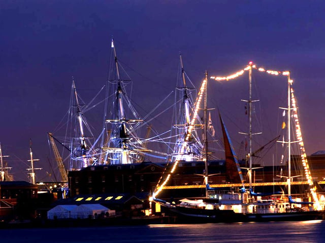 Tall ship and HMS Victory lit up at IFOS, viewed from Gosport
International Festival of the Sea 2005. The News 053128-1