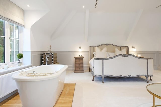 The master bedroom is incredibly large. It even has space for a standing bath in the bedroom space.