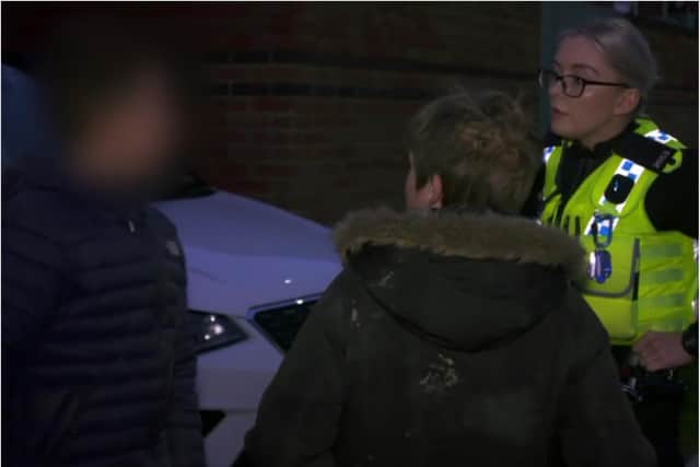 PC Sophie O'Reilly chats to the two youngsters stopped in Fox Hill after they had trespassed on a building site. (Photo: Channel 4).