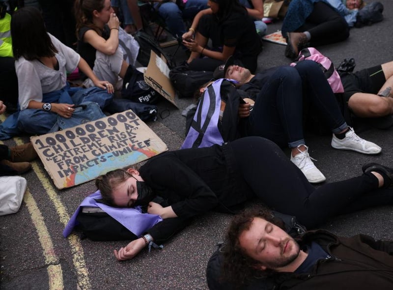 Protesters lay down in the street as part of the 'Impossible Rebellion' protests (Photo by Dan Kitwood/Getty Images)