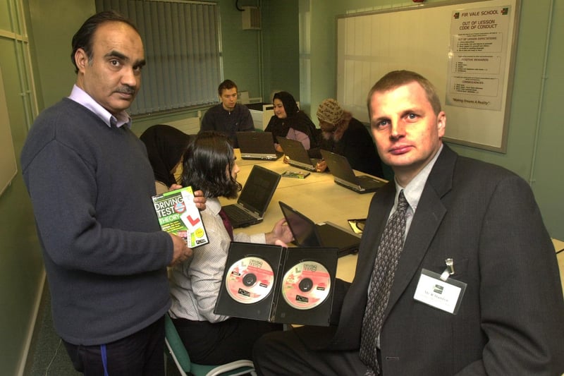 Pictured   at Fir Vale school, Sheffield in December 2003, where adults were using IT technology to study for their driving theory test, are course tutor Amjad Janjua, deputy head Bob Hamlyn and course members behind them