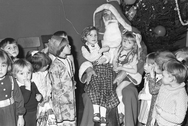 Children meet their favourite character at the Eastlea Community Centre's playgroup Christmas party at Seaham in 1979.