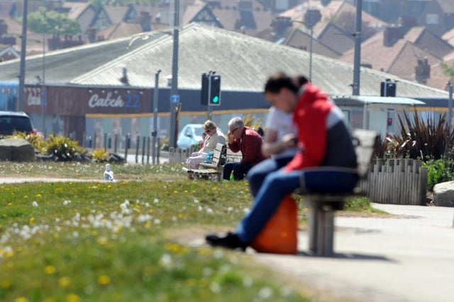 People enjoy the benches at Seaburn