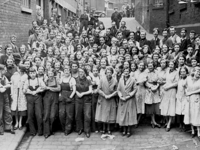 This photo is of workers from a company called Mayes who made baskets, woven furniture and other woven household items many years ago. It was taken circa 1937