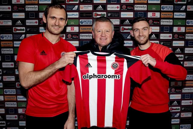 James Hanson and Jay O'Shea pictured signing for Sheffield United with boss Chris Wilder: Simon Bellis/Sportimage
