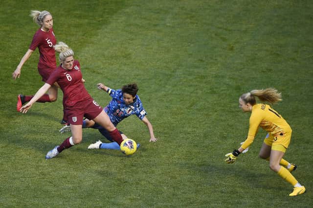 Millie Bright (second left) and Ellie Roebuck (right) in action for England in 2020 (photo by Sarah Stier/Getty Images).
