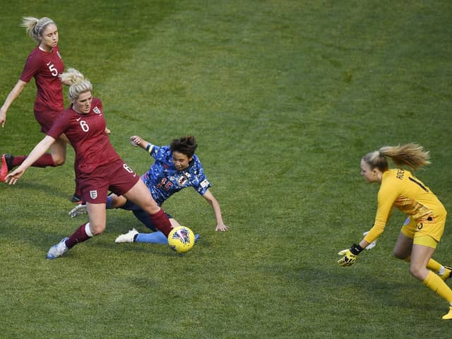 Millie Bright (second left) and Ellie Roebuck (right) in action for England in 2020 (photo by Sarah Stier/Getty Images).