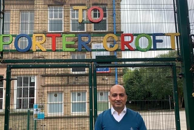 Sheffield City Council member Coun Mazher Iqbal outside the gates of Porter Croft Primary School, one of nine in Sheffield currently trialling a School Streets road safety project