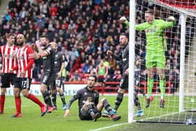 Dean Henderson of Sheffield United reacts after saving a shot from Mario Vrancic of Norwich City during the Premier League match between Sheffield United and Norwich City at Bramall Lane on March 07, 2020 in Sheffield, United Kingdom: Nigel Roddis/Getty Images