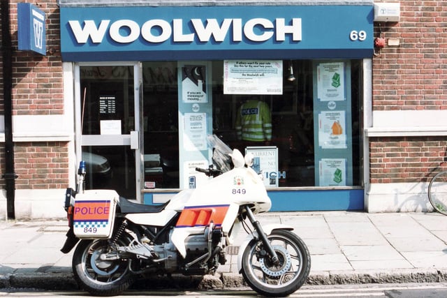 In this picture from August 1991, a police officer pays a visit to Woolwich on Osborne Road. For those who don't remember, it was a building society and was acquired by Barclays in 2000 meaning it vanished from high street.