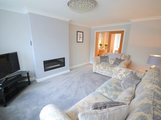 Sitting room/lounge - A beautifully presented sitting room with Oak double glazed doors leading off from the dining room which can be opened when entertaining or shut when relaxing. Having an attractive living flame feature gas fire, various power sockets, t.v. aerial point, central heating radiator, coving complements the ceiling and upvc double glazed window provides a pleasant outlook.