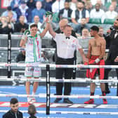 Hopey Price gets his arm raised after beating Leeds rival Zahid Hussain.
