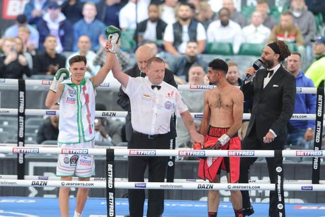 Hopey Price gets his arm raised after beating Leeds rival Zahid Hussain.