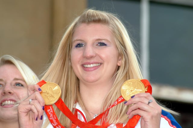 Rebecca shows her medals to the fans