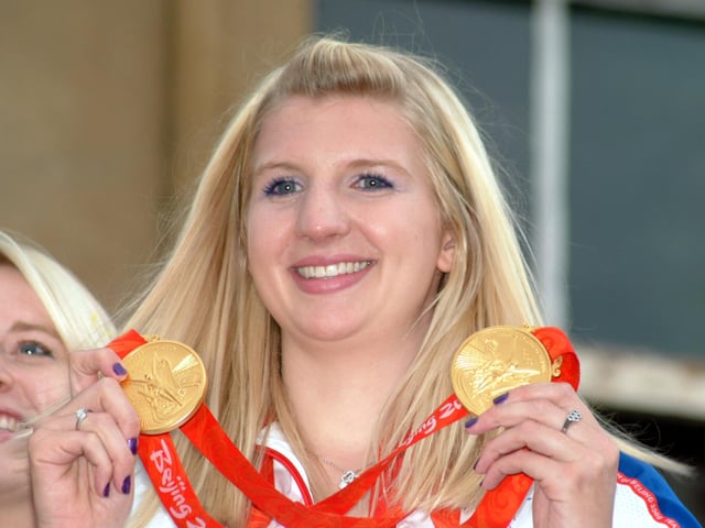 Rebecca shows her medals to the fans