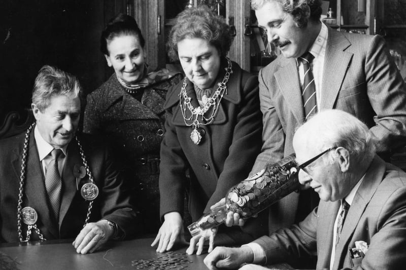 A bottle full of pennies being counted by South Tyneside's Mayor and Mayoress, Coun Murtagh and Coun Mrs Elizabeth Diamond; Also pictured are Dr Nathan, Mrs Strang, and Terry Pearson at the start of a fund-raising drive to provide an indoor riding school for disabled people.