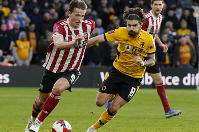 Sander Berge of Sheffield United and Ruben Neves of Wolverhampton Wanderers: Andrew Yates / Sportimage