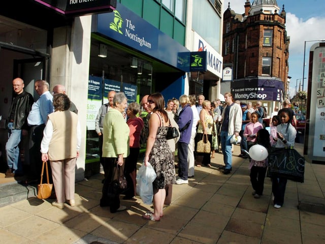 Worried customers queue outside the Northern Rock building society on Pinstone Street, Sheffield, on September 14, 2007