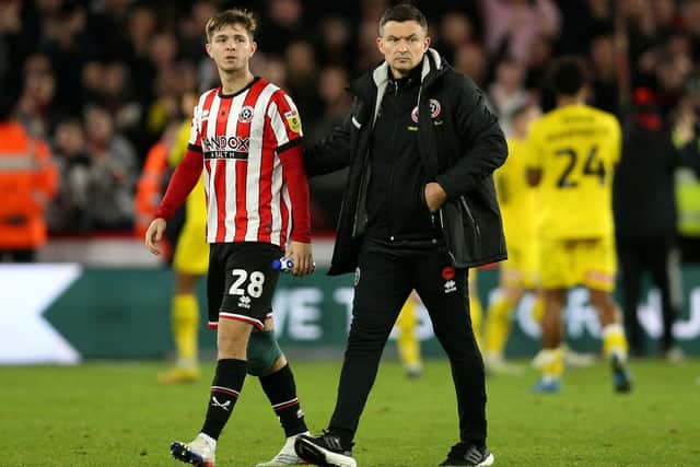 Sheffield United manager Paul Heckingbottom consoles James McAtee after the final whistle following the Sky Bet Championship match at Bramall Lane, Sheffield. Nigel French/PA Wire.