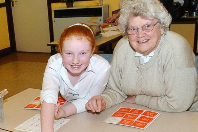 Sophy Sanderson aged nine with Audrey Mallet playing a game, December 2007.