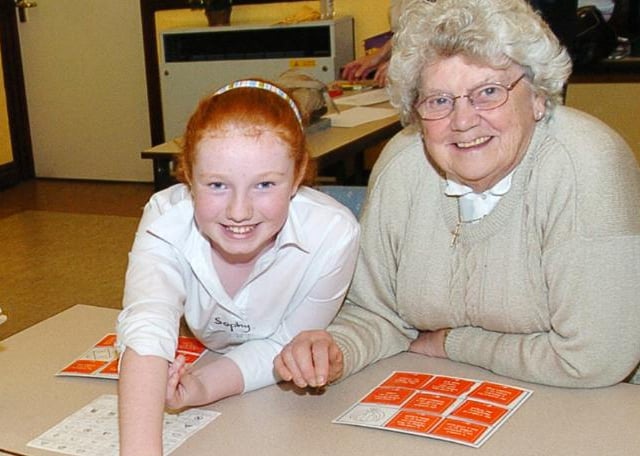 Sophy Sanderson aged nine with Audrey Mallet playing a game, December 2007.