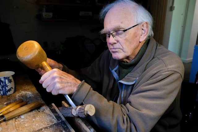 Michael Bayley, who had to have a leg amputated after being hit when he was crossing the road in Nether Edge, Sheffield. The 85-year-old is holding an exhibition of his wood carvings to raise money for the charity ASSIST, which supports asylum seekers. Photo by Dean Atkins