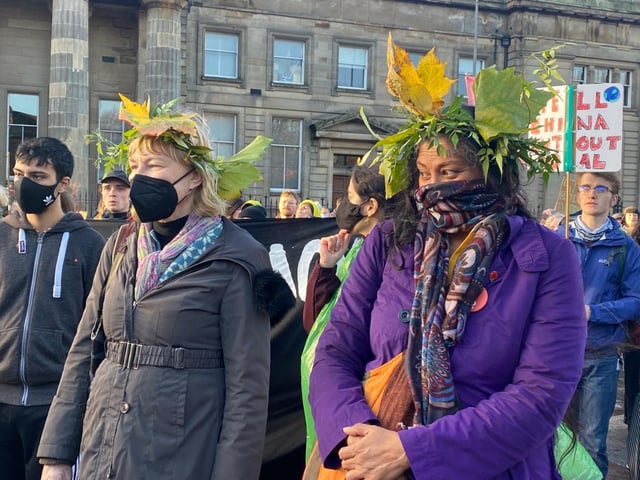 Activists out on Saturday wearing head pieces created with real leaves.