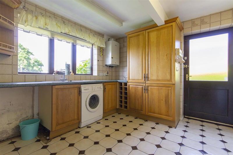 The kitchen is part-tiled and fitted with a range of wall, drawer and base units with complementary work surfaces over. It has an inset single drainer stainless steel sink with mixer tap, with integrated appliances to include a fridge/freezer, electric oven and four-ring gas hob with concealed extractor over. Included in the sale is the automatic washing machine.