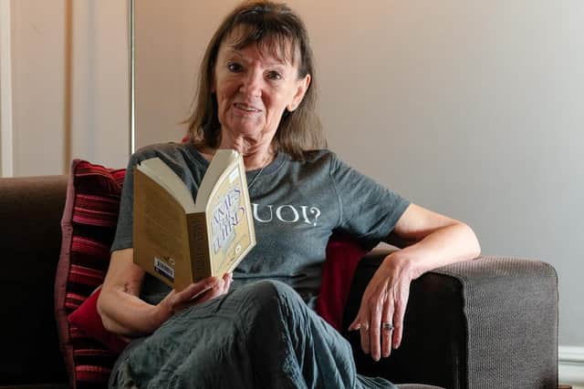 Author Maggie Ballinger at home in Sheffield with her new novel about an alternitive Royal Lineage