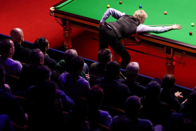 Neil Robertson of Australia plays a shot in their first round match against Ashley Hugill of England during Day Four of the Betfred World Snooker Championship at Crucible Theatre on April 19, 2022 in Sheffield, England. (Photo by George Wood/Getty Images)