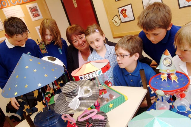 Woodsetts Primary headteacher Heather Green is in the regional finals for National Headteacher of the Year award.
Picture: Heather Green with school pupils - discussing the fair ground models pupils have made.
