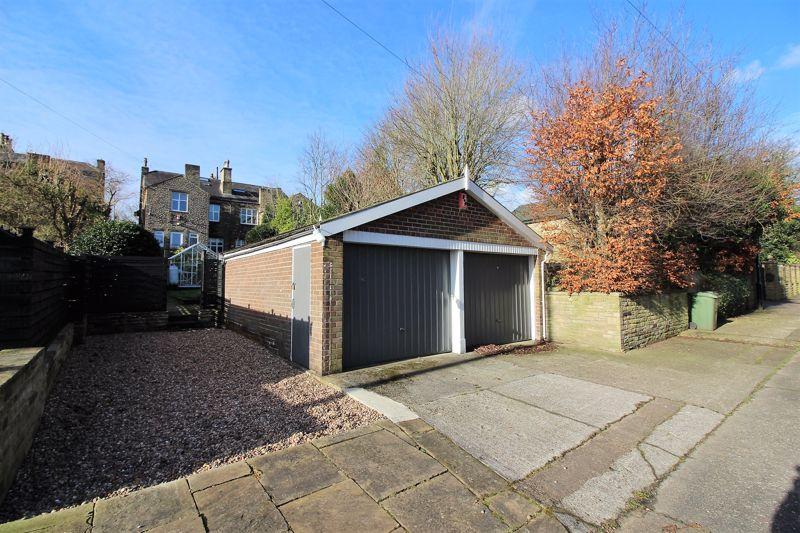 Double detached garage with power, light and electric up and over door.