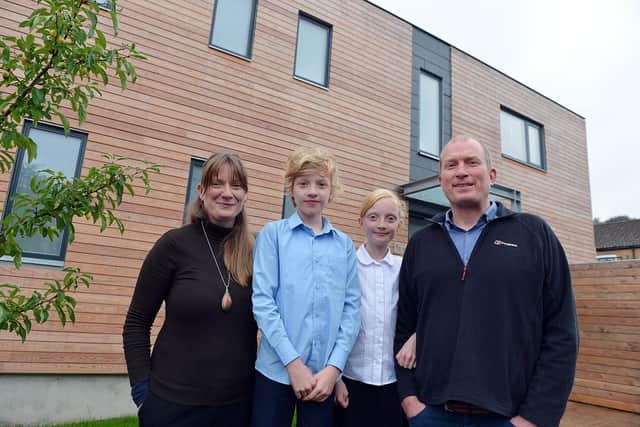 Architect Dan Bilton and his partner Ann Lynch with their children Isabella and Alfred outside the ordinary 1950s home in Sheffield which they have transformed into an ultra-energy efficient certified Passive House