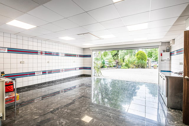 The sizeable garage has a tiled floor, giving it the feel of an upmarket car showroom.