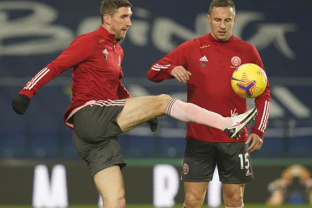 Chris Basham and Phil Jagielka (R) are both expected to be in the Sheffield United squad for Sunday's Premier League game against Leicester City: Andrew Yates/Sportimage