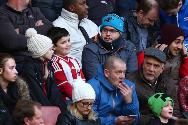 United supporters watch their side take on Bradford City at Bramall Lane in December 2015.