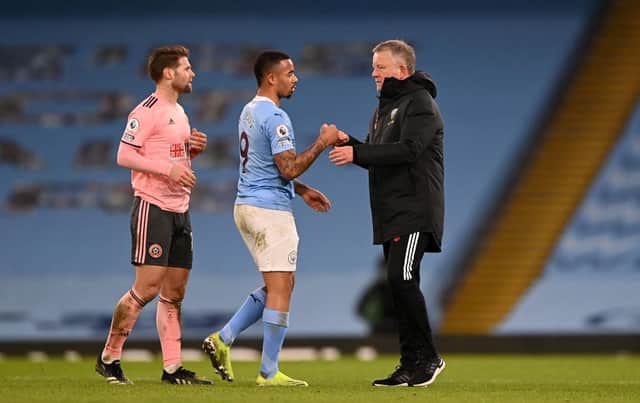 Chris Wilder, manager of Sheffield United, and Gabriel Jesus of Manchester City interact after  the Premier League.