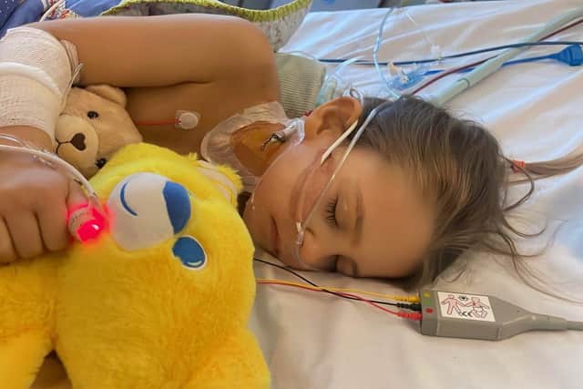 A mum has revealed her horror after her six-year-old daughter's stomach aches turned out to be a rare genetic disease. Daughter Esmee is pictured in Sheffield Children's Hospital