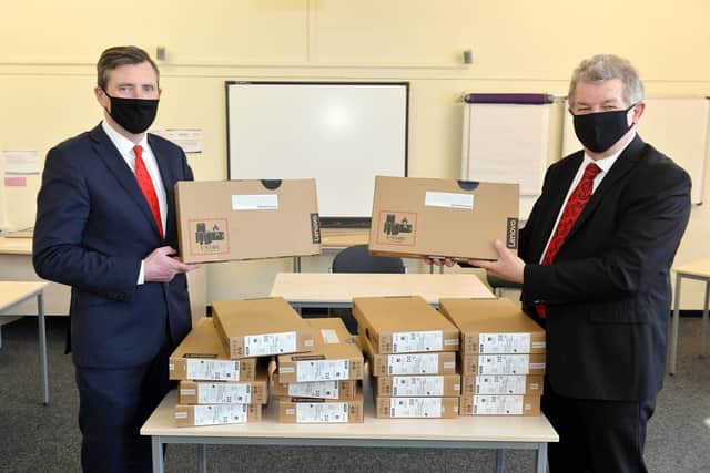 Schools collected laptops from Rockingham Professional Development Centre. Pictured are David Naisbitt, CEO of Inspire trust and Cllr Gordan Watson, deputy leader of the council and cabinet member for children's services & neighbourhood working.