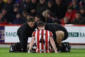 John Fleck of Sheffield United receives treatment before limping off against Rotherham United: Darren Staples / Sportimage