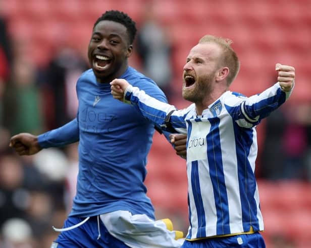 DELIGHT: Barry Bannan (right) celebrates victory with teammate Anthony Musaba