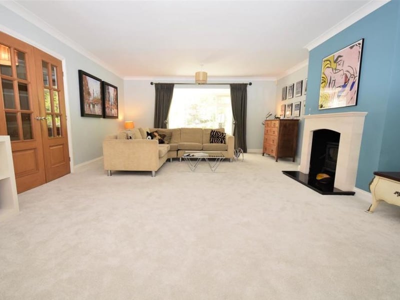 Another view of the living room. At one end, you can step down into the snug, which is a charming space that has double doors opening directly on to the patio in the back garden.