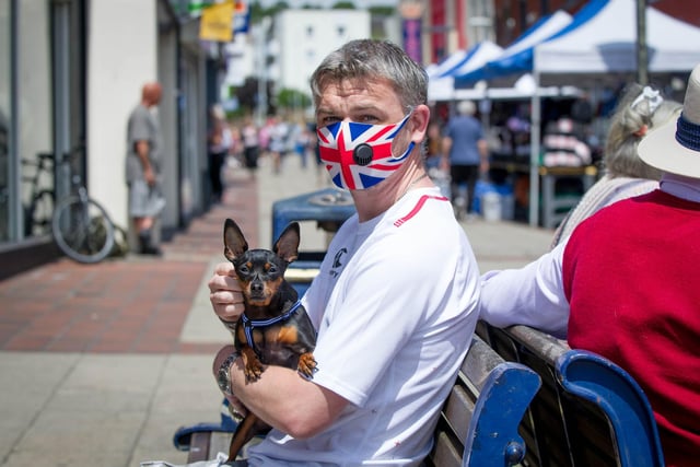 Tony Watson with his dog, Muki at Cosham High Street as stores reopened.