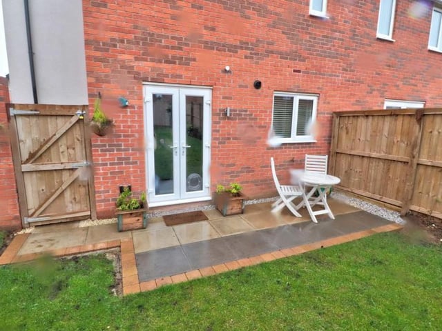 Time to have a look outside and while it might have been raining when this photo was taken, it still shows a pleasant patio area that would be perfect for relaxing with a cuppa, or something stiffer, when the weather is better.