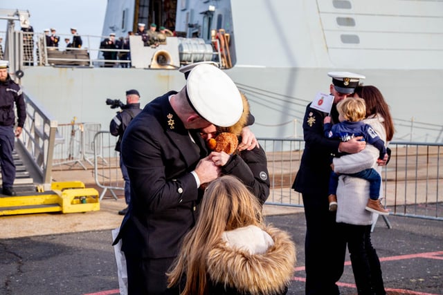 Families embracing their loved ones as soon as they step off HMS Defender. Picture: Habibur Rahman