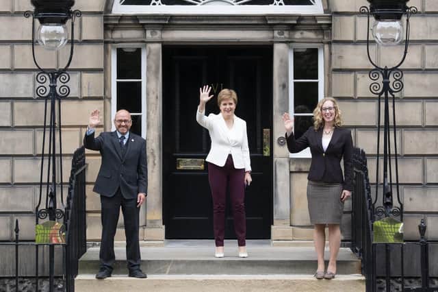 File photo dated 30/08/21 of First Minister Nicola Sturgeon (centre) welcoming Scottish Green co-leaders Patrick Harvie and Lorna Slater at Bute House, Charlotte Square, Edinburgh, following their Government Ministerial appointments. Nicola Sturgeon set out details of her Government's deal with the Greens as Holyrood returns after the summer recess. Issue date: Tuesday August 31, 2021.