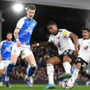 LONDON, ENGLAND - FEBRUARY 23: Ivan Cavaleiro of Fulham battles for possession with Josh Knight of Peterborough United during the Sky Bet Championship match between Fulham and Peterborough United at Craven Cottage on February 23, 2022 in London, England. (Photo by Alex Davidson/Getty Images)