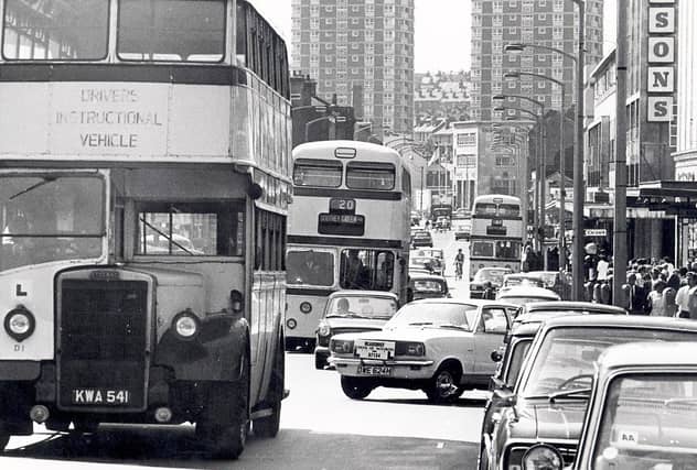 The Moor is busy with cars and buses in this photo from the 1970s