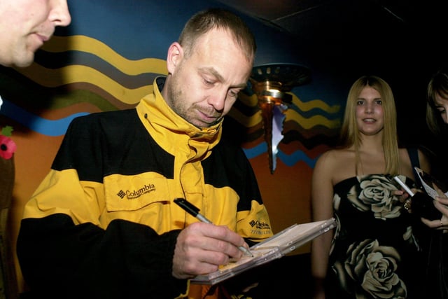 Aussie Star Jason Donovan signing aughtographs for fans before his stage appearence at Karisma Night Club in 2002